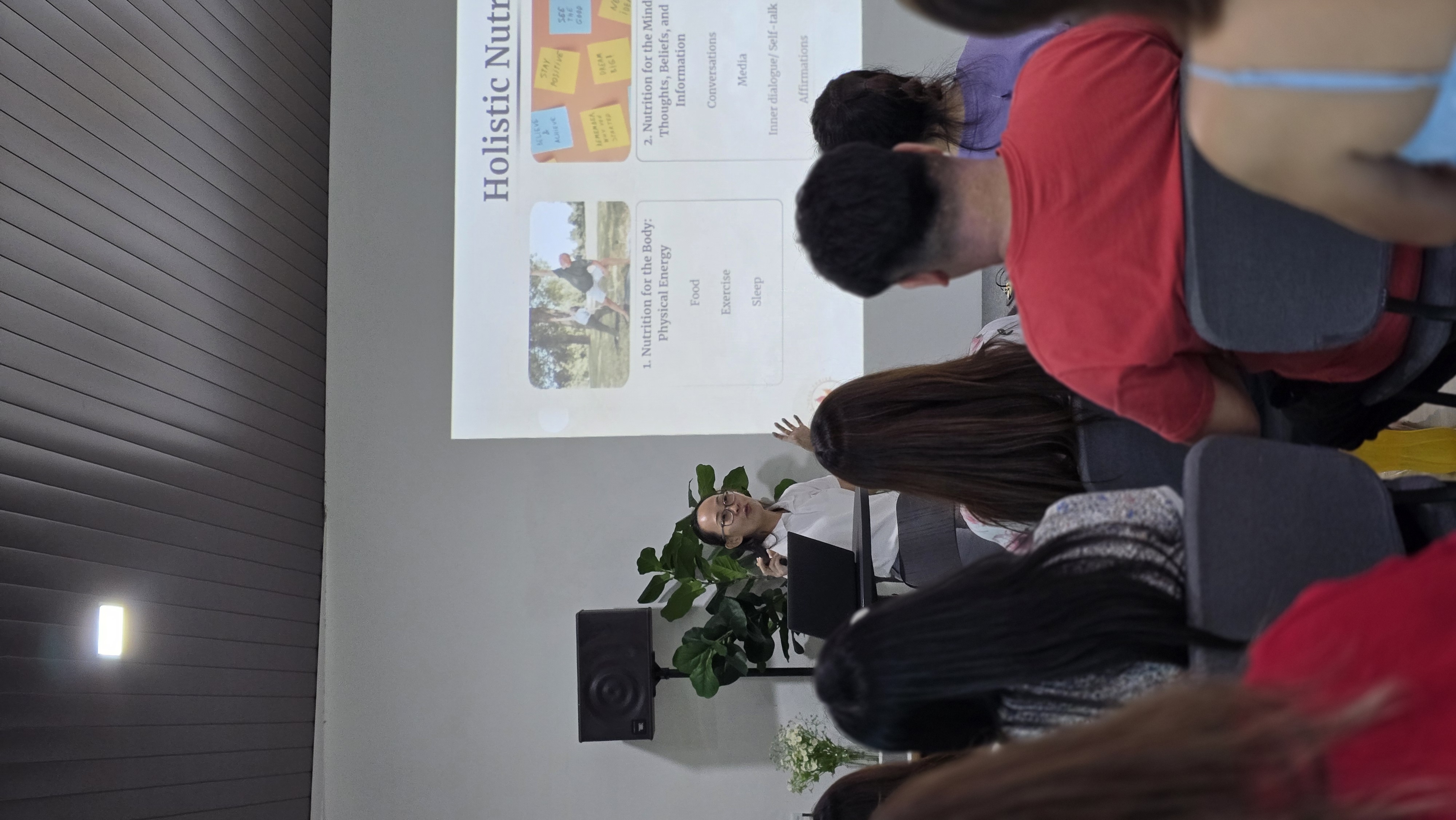 Lorraine Lau presenting at a holistic health workshop